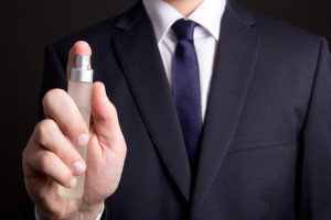 perfume bottle in business man hand