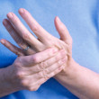 Woman massaging her hand